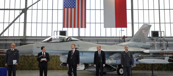 Polish and US officials stand in front of a F-16 fighter jet during the contract signing ceremony of 40 Lockheed Martin’s joint air-to-surface standoff missiles. Polish and US officials stand in front of a F-16 fighter jet during the contract signing ceremony of 40 Lockheed Martin’s joint air-to-surface standoff missiles. - Sputnik International