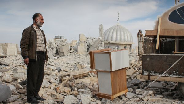 Syrian man salvages furniture from his home that was destroyed in bombing, in the northwestern city of Maraat al-Numan, Syria - Sputnik International