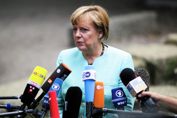 German Chancellor Angela Merkel, speaks to media after a visit of a so called 'Welcome Class', a special school class for migrants and refugees at the Ferdinand-Freiligrath school in Berlin, Germany, Thursday, Sept. 10, 2015. - Sputnik International