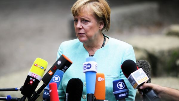 German Chancellor Angela Merkel, speaks to media after a visit of a so called 'Welcome Class', a special school class for migrants and refugees at the Ferdinand-Freiligrath school in Berlin, Germany, Thursday, Sept. 10, 2015. - Sputnik International