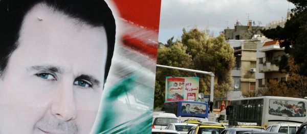 Banner bearing a portrait of Syrian President Bashar al-Assad in a street in the city of Damascus Banner bearing a portrait of Syrian President Bashar al-Assad in a street in the city of Damascus - Sputnik International