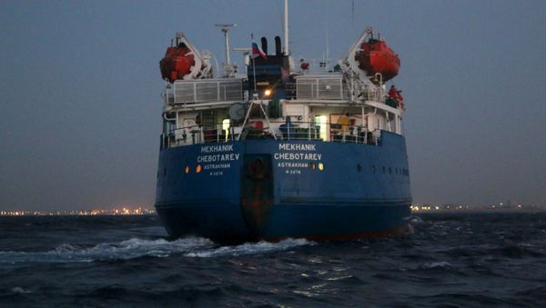 A Russian-flagged oil tanker is seen in Tripoli Naval Base after coast guard of the central region guards captured it A Russian-flagged oil tanker is seen in Tripoli Naval Base after coast guard of the central region guards captured it - Sputnik International
