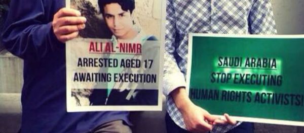 Demonstrators hold a picture of Ali Muhammed al-Nimr after his appeal case failed. Demonstrators hold a picture of Ali Muhammed al-Nimr after his appeal case failed. - Sputnik International