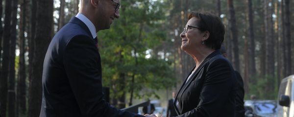 Ukrainian Prime Minister Arseniy Yatsenyuk, left, greets Poland’s Prime Minister Ewa Kopacz, prior to a commemoration ceremony for the victims of Soviet-era repressions near the village of Bykovnia outside Kiev, Ukraine, Thursday, Sept. 17, 2015 Ukrainian Prime Minister Arseniy Yatsenyuk, left, greets Poland’s Prime Minister Ewa Kopacz, prior to a commemoration ceremony for the victims of Soviet-era repressions near the village of Bykovnia outside Kiev, Ukraine, Thursday, Sept. 17, 2015 - Sputnik International
