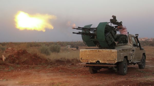 Rebel fighters fire a heavy machine gun during clashes with Syrian pro-government forces on the frontline facing Deir al-Zoghb, a government-held area in the northwestern Idlib province, on August 31, 2015 Rebel fighters fire a heavy machine gun during clashes with Syrian pro-government forces on the frontline facing Deir al-Zoghb, a government-held area in the northwestern Idlib province, on August 31, 2015 - Sputnik International