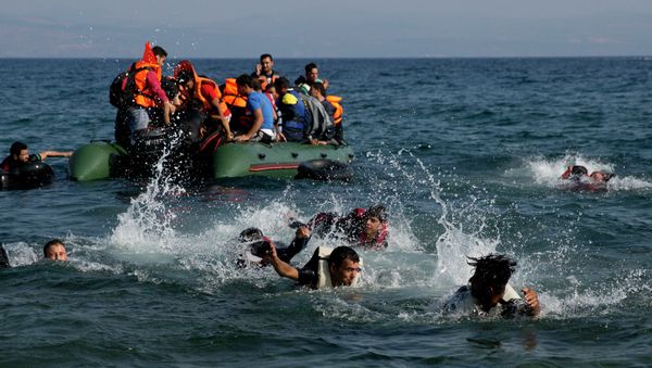 Migrant whose boat stalled at sea while crossing from Turkey to Greece swim to approach the shore of the island of Lesbos, Greece, on Sunday, Sept. 20, 2015 Migrant whose boat stalled at sea while crossing from Turkey to Greece swim to approach the shore of the island of Lesbos, Greece, on Sunday, Sept. 20, 2015 - Sputnik International