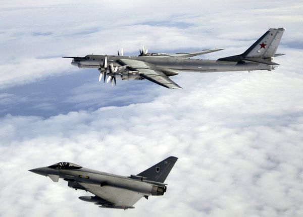 A Tu-95 being escorted by an RAF Typhoon. File photo A Tu-95 being escorted by an RAF Typhoon. File photo - Sputnik International