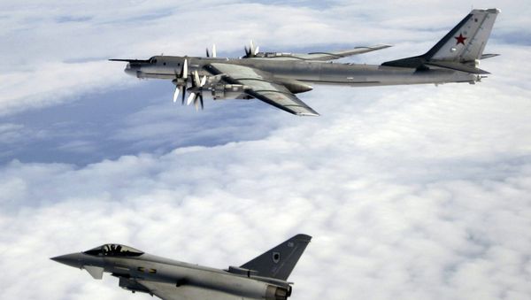 A Tu-95 being escorted by an RAF Typhoon. File photo  - Sputnik International