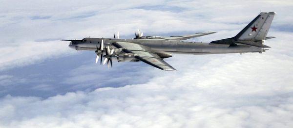A Tu-95 being escorted by an RAF Typhoon - Sputnik International