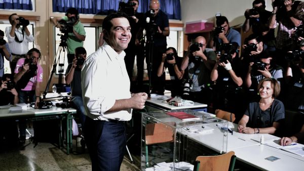 Greek radical-left Syriza party leader and former Prime Minister Alexis Tsipras smiles prior to cast his vote at a polling station in central Athens on September 20, 2015 - Sputnik International