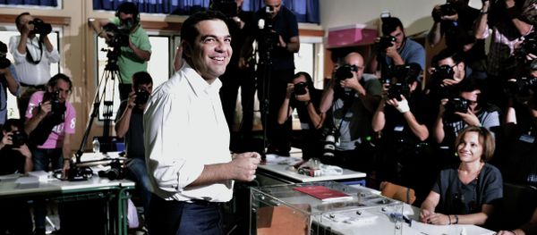 Greek radical-left Syriza party leader and former Prime Minister Alexis Tsipras smiles prior to cast his vote at a polling station in central Athens on September 20, 2015 - Sputnik International