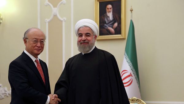 Iranian President Hassan Rouhani, center, welcomes U.N. nuclear chief Yukiya Amano at the start of their meeting in Tehran, Iran, Sunday, Sept. 20, 2015 Iranian President Hassan Rouhani, center, welcomes U.N. nuclear chief Yukiya Amano at the start of their meeting in Tehran, Iran, Sunday, Sept. 20, 2015 - Sputnik International