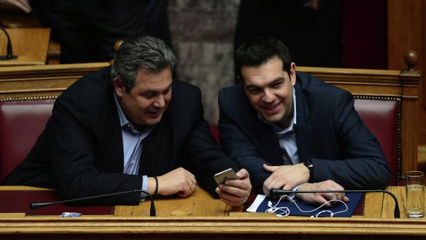 Greece's prime minister Alexis Tsipras (R) chats with member of coalition government and defense minister Panos Kammenos the confidence vote early on February 11, 2015. - Sputnik International