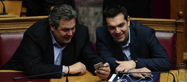 Greece's prime minister Alexis Tsipras (R) chats with member of coalition government and defense minister Panos Kammenos the confidence vote early on February 11, 2015. - Sputnik International
