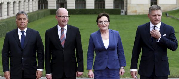 Prime Ministers of the Visegrad Group (V4), Hungary's Prime Minister Viktor Orban (L-R), Czech Republic's Prime Minister Bohuslav Sobotka, Poland's Prime Minister Ewa Kopacz and Slovakia's Prime Minister Robert Fico pose for a group photo during an extraordinary Visegrad Group summit aimed at resolving the migration crisis in Prague, Czech Republic, September 4, 2015. Prime Ministers of the Visegrad Group (V4), Hungary's Prime Minister Viktor Orban (L-R), Czech Republic's Prime Minister Bohuslav Sobotka, Poland's Prime Minister Ewa Kopacz and Slovakia's Prime Minister Robert Fico pose for a group photo during an extraordinary Visegrad Group summit aimed at resolving the migration crisis in Prague, Czech Republic, September 4, 2015. - Sputnik International