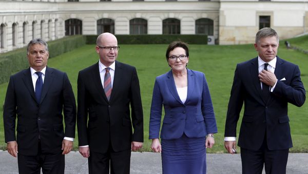 Prime Ministers of the Visegrad Group (V4), Hungary's Prime Minister Viktor Orban (L-R), Czech Republic's Prime Minister Bohuslav Sobotka, Poland's Prime Minister Ewa Kopacz and Slovakia's Prime Minister Robert Fico pose for a group photo during an extraordinary Visegrad Group summit aimed at resolving the migration crisis in Prague, Czech Republic, September 4, 2015. - Sputnik International