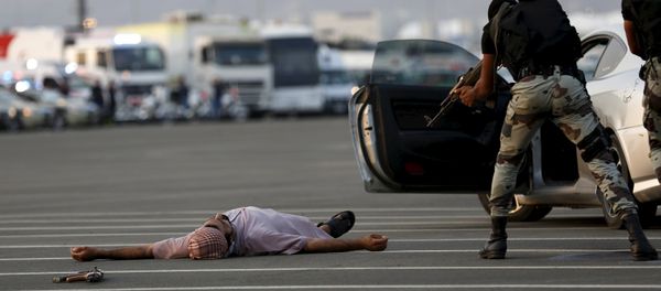 A member of Saudi security forces is seen during a mock encounter scene during a military parade in preparation for the annual Haj pilgrimage in the holy city of Mecca September 17, 2015 A member of Saudi security forces is seen during a mock encounter scene during a military parade in preparation for the annual Haj pilgrimage in the holy city of Mecca September 17, 2015 - Sputnik International