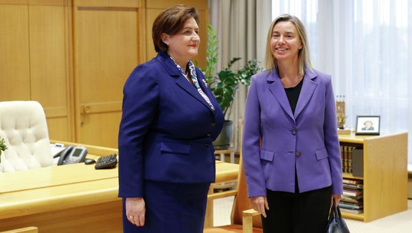 European Union High Representative Federica Mogherini, right, and Lithuania's Speaker of the Parliament Loreta Grauziniene pose for photographers during a meeting at the Parliament's palace in Vilnius, Lithuania, Monday, Sept. 21, 2015 - Sputnik International