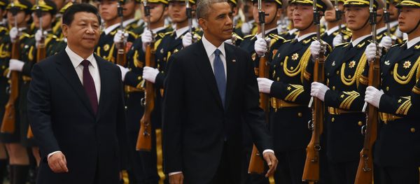 US President Barack Obama (C) reviews an honour guard with Chinese President Xi Jinping in the Great Hall of the People in Beijing on November 12, 2014 US President Barack Obama (C) reviews an honour guard with Chinese President Xi Jinping in the Great Hall of the People in Beijing on November 12, 2014 - Sputnik International