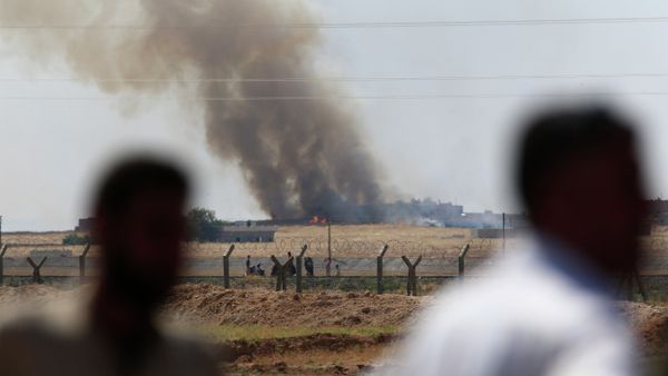 People watch as smoke from a US-led airstrike rises over the outskirts of Tal Abyad, Syria. People watch as smoke from a US-led airstrike rises over the outskirts of Tal Abyad, Syria. - Sputnik International