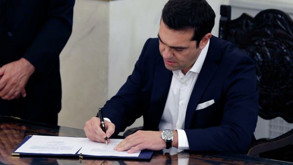 Leftwing leader Alexis Tsipras signs official documents after being sworn in as prime minister at a ceremony attended by President Prokopis Pavlopoulos in Athens on Monday, Sept. 21, 2015 Leftwing leader Alexis Tsipras signs official documents after being sworn in as prime minister at a ceremony attended by President Prokopis Pavlopoulos in Athens on Monday, Sept. 21, 2015 - Sputnik International