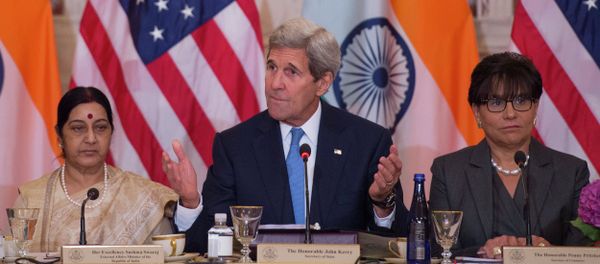 US Secretary of State John Kerry (C) speaks Indian External Affairs Minister Sushma Swaraj (L) during a US-India Strategic & Commercial Dialogue plenary session at the US Department of State in Washington, DC, September 22, 2015, with US Secretary of Commerce Penny Pritzker (R) US Secretary of State John Kerry (C) speaks Indian External Affairs Minister Sushma Swaraj (L) during a US-India Strategic & Commercial Dialogue plenary session at the US Department of State in Washington, DC, September 22, 2015, with US Secretary of Commerce Penny Pritzker (R) - Sputnik International