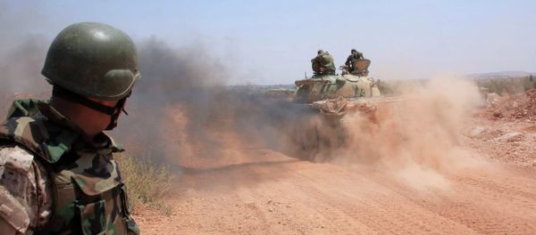 Syrian government forces drive a tank on a road in the Maysar neighbourhood of the northern Syrian city of Aleppo on July 29, 2015 Syrian government forces drive a tank on a road in the Maysar neighbourhood of the northern Syrian city of Aleppo on July 29, 2015 - Sputnik International
