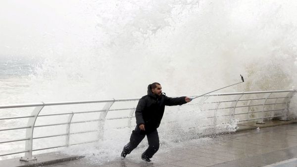 A man takes a selfie by a crashing wave on Beirut's Corniche, a seaside promenade, as high winds sweep through Lebanon during a storm in this February 11, 2015 file photo. A man takes a selfie by a crashing wave on Beirut's Corniche, a seaside promenade, as high winds sweep through Lebanon during a storm in this February 11, 2015 file photo. - Sputnik International