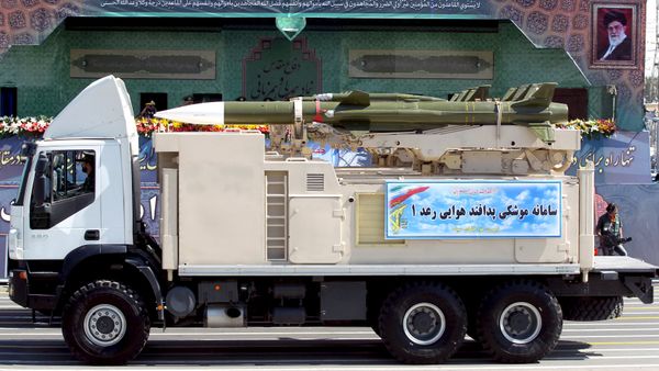 A military truck carrying a Raad missile drives past a picture of Iran's Supreme Leader Ayatollah Ali Khamenei (R) during a parade marking the anniversary of the Iran-Iraq war (1980-88), in Tehran A military truck carrying a Raad missile drives past a picture of Iran's Supreme Leader Ayatollah Ali Khamenei (R) during a parade marking the anniversary of the Iran-Iraq war (1980-88), in Tehran - Sputnik International