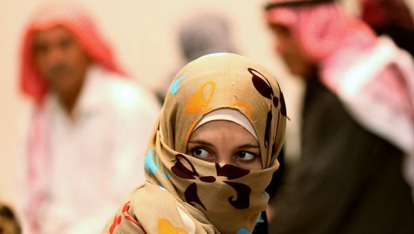 A Syrian refugee waits at a clinic at the Zaatari refugee camp as German Economy Minister Sigmar Gabriel visits the camp near Mafraq, north of Amman, Jordan, Tuesday, Sept. 22, 2015. - Sputnik International