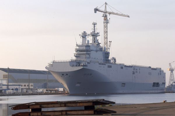 In this Friday, Sept. 5, 2014 file photo, the Vladivostok warship, the first of two Mistral-class helicopter carriers ordered by Russia, docks on the port of Saint-Nazaire, western France. Both ships have since been sold to Egypt. - Sputnik International