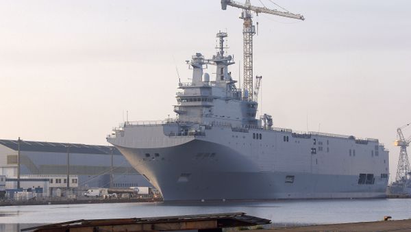 In this Friday, Sept. 5, 2014 file photo, the Vladivostok warship, the first of two Mistral-class helicopter carriers ordered by Russia, docks on the port of Saint-Nazaire, western France. - Sputnik International