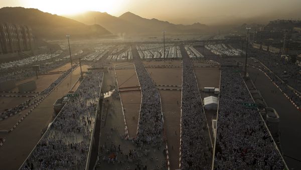 Muslim pilgrims walk on roads as they head to cast stones at pillars symbolizing Satan during the annual haj pilgrimage in Mina on the first day of Eid al-Adha, near the holy city of Mecca September 24, 2015 Muslim pilgrims walk on roads as they head to cast stones at pillars symbolizing Satan during the annual haj pilgrimage in Mina on the first day of Eid al-Adha, near the holy city of Mecca September 24, 2015 - Sputnik International