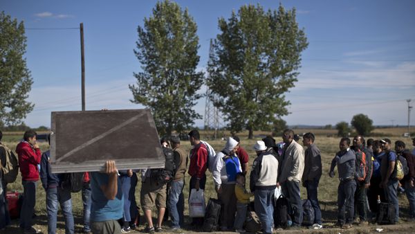 People queue in order to get inside a newly established reception center for migrants and refugees close to Croatia's border with Serbia, in the town of Opatovac, Croatia People queue in order to get inside a newly established reception center for migrants and refugees close to Croatia's border with Serbia, in the town of Opatovac, Croatia - Sputnik International