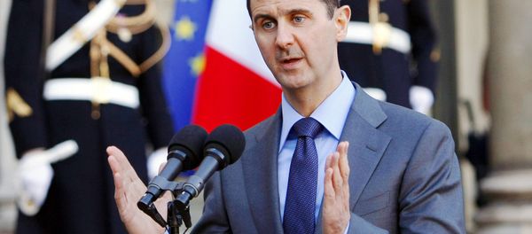 In this Thursday Dec. 9, 2010 file photo, Syria President Bashar al-Assad addresses reporters following his meeting with French President Nicolas Sarkozy at the Elysee Palace in Paris, France. - Sputnik International
