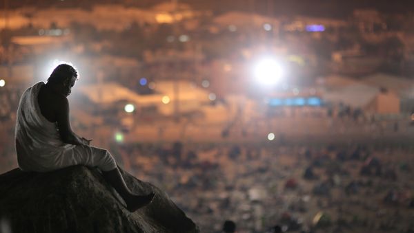 Muslim pilgrim prays on a rocky hill called the Mountain of Mercy, on the Plain of Arafat, near the holy city of Mecca, Saudi Arabia Muslim pilgrim prays on a rocky hill called the Mountain of Mercy, on the Plain of Arafat, near the holy city of Mecca, Saudi Arabia - Sputnik International
