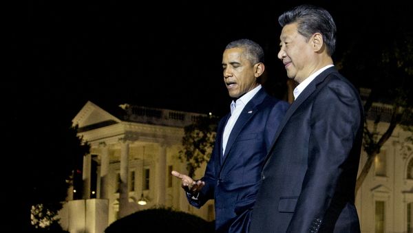 U.S. President Barack Obama and Chinese President Xi Jinping, right, walk on the North Lawn of the White House in Washington - Sputnik International