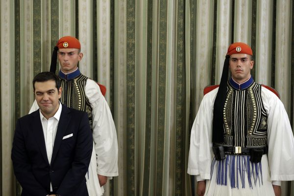Greece's Prime Minister Alexis Tsipras winks during his cabinet's swearing in ceremony at the presidential palace in Athens, Wednesday, Sept. 23, 2015 Greece's Prime Minister Alexis Tsipras winks during his cabinet's swearing in ceremony at the presidential palace in Athens, Wednesday, Sept. 23, 2015 - Sputnik International