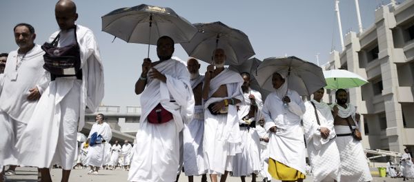 Muslim pilgrims leave after throwing pebbles at pillars during the Jamarat ritual, the stoning of Satan, in Mina near the holy city of Mecca, on September 24, 2015 - Sputnik International