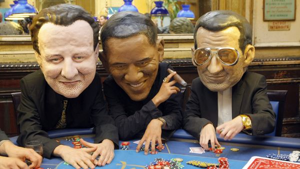 Oxfam international activists pose as British Prime Minister, David Cameron, left, United State President Barak Obama, and French President Nicolas Sarkozy, right. - Sputnik International