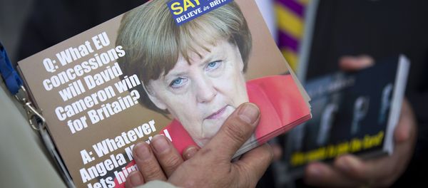 A supporter holds leaflets showing German Chancellor Angela Merkel, as they distribute them in Ramsgate, east of London, as Leader of the UK Independence Party (UKIP) Nigel Farage (not pictured) kicks off their Say No To The EU tour on September 7, 2015, during the party’s referendum campaign. A supporter holds leaflets showing German Chancellor Angela Merkel, as they distribute them in Ramsgate, east of London, as Leader of the UK Independence Party (UKIP) Nigel Farage (not pictured) kicks off their Say No To The EU tour on September 7, 2015, during the party’s referendum campaign. - Sputnik International