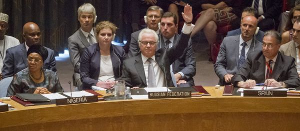Russian U.N. Ambassador Vitaly Churkin, center, raises his hand to cast a vote to veto Russian U.N. Ambassador Vitaly Churkin, center, raises his hand to cast a vote to veto - Sputnik International