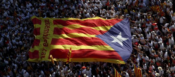 Catalan pro-independence supporters hold a giant estelada (Catalan separatist flag) during a demonstration called Via Lliure a la Republica Catalana (Way of Freedom for the Republic of Catalonia) on the Diada de Catalunya (Catalunya's National Day) in Barcelona, Spain, September 11, 2015. Catalan pro-independence supporters hold a giant estelada (Catalan separatist flag) during a demonstration called Via Lliure a la Republica Catalana (Way of Freedom for the Republic of Catalonia) on the Diada de Catalunya (Catalunya's National Day) in Barcelona, Spain, September 11, 2015. - Sputnik International