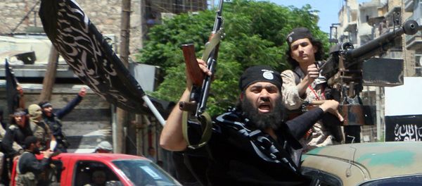 Fighters from Al-Qaeda's Syrian affiliate Al-Nusra Front drive in the northern Syrian city of Aleppo. Fighters from Al-Qaeda's Syrian affiliate Al-Nusra Front drive in the northern Syrian city of Aleppo. - Sputnik International