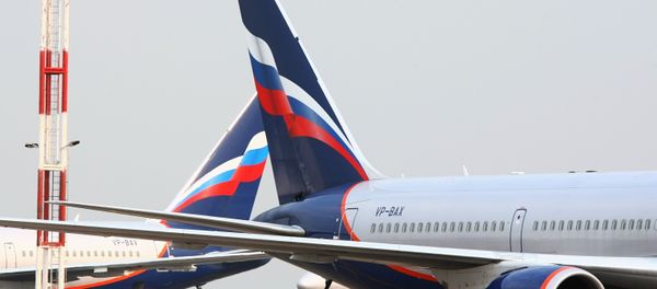 An Aeroflot Boeing 767, right, at the Sheremetyevo International Airport in Moscow - Sputnik International