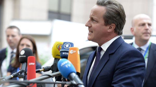 Britain's Prime minister David Cameron talks to journalists as he arrives to attend an European Union (EU) emergency summit on the migration crisis with a focus on strengthening external borders, at the EU Headquarters in Brussels, on September 23, 2015 Britain's Prime minister David Cameron talks to journalists as he arrives to attend an European Union (EU) emergency summit on the migration crisis with a focus on strengthening external borders, at the EU Headquarters in Brussels, on September 23, 2015 - Sputnik International