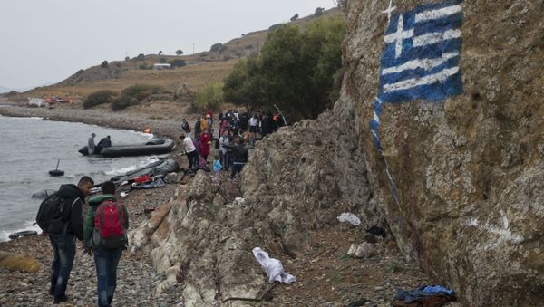 A file photo showing a greek flag is painted on a rock, as migrants arrive on the shores of the Greek island of Lesbos after crossing the Aegean Sea from Turkey on a inflatable dinghy , clamber over rocks on Tuesday, Sept. 22, 2015 A file photo showing a greek flag is painted on a rock, as migrants arrive on the shores of the Greek island of Lesbos after crossing the Aegean Sea from Turkey on a inflatable dinghy , clamber over rocks on Tuesday, Sept. 22, 2015 - Sputnik International
