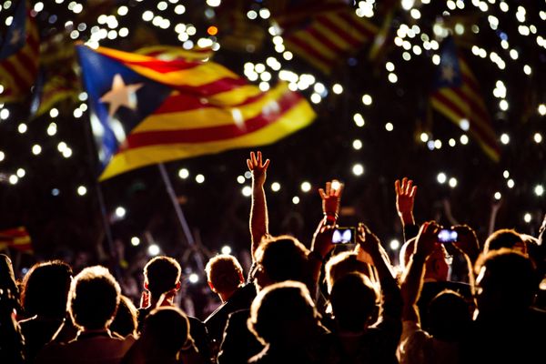 Pro independence supporters wave estelada or pro independence flags during a rally of Junts pel Si or Together for YES in Barcelona, Spain, Friday, Sept. 25, 2015 Pro independence supporters wave estelada or pro independence flags during a rally of Junts pel Si or Together for YES in Barcelona, Spain, Friday, Sept. 25, 2015 - Sputnik International