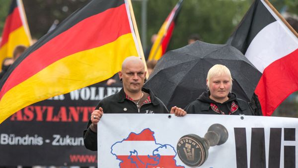 German right-wing supporters of Thuegida, the local group of the PEGIDA movement Patriotic Europeans Against the Islamification of the Occident take part in a march in Suhl, eastern Germany on August 17, 2015. - Sputnik International