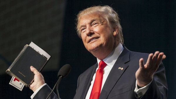 U.S. Republican presidential candidate Donald Trump holds his bible while speaking at the Iowa Faith and Freedom Coalition Forum in Des Moines, Iowa, September 19, 2015 - Sputnik International